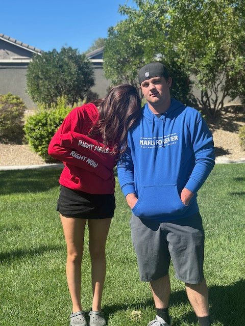 Two fans in MAFIA hoodies